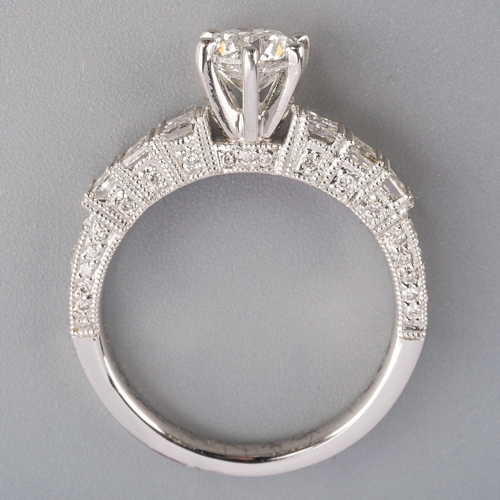 713 - A diamond ring, set with a modern round brilliant cut diamond, measuring approx 5.64mm diameter, to ... 