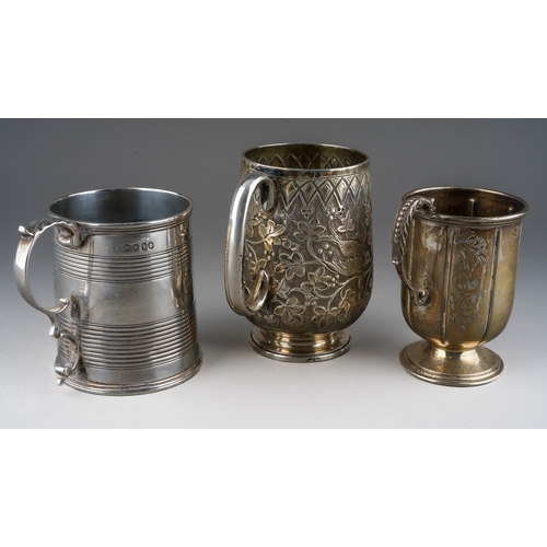 717 - Three various silver Christening cups to include: 
1. Victorian Aesthetic chased and engraved with b... 