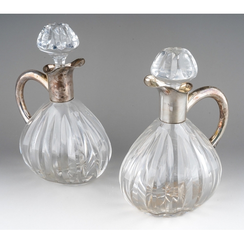 724 - A pair of Continental probably German 835 silver mounted glass decanters and stoppers, lobed bodies ... 