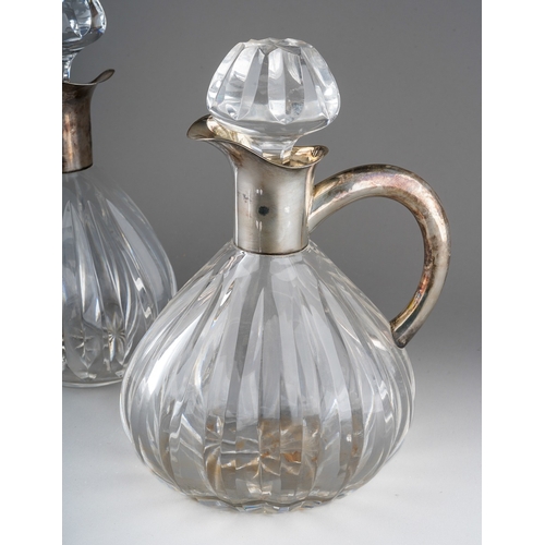 724 - A pair of Continental probably German 835 silver mounted glass decanters and stoppers, lobed bodies ... 