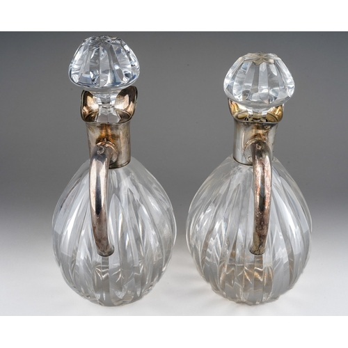 724 - A pair of Continental probably German 835 silver mounted glass decanters and stoppers, lobed bodies ... 