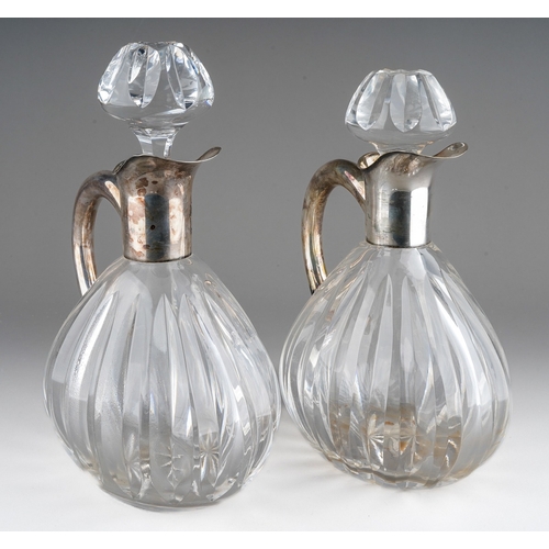 724 - A pair of Continental probably German 835 silver mounted glass decanters and stoppers, lobed bodies ... 