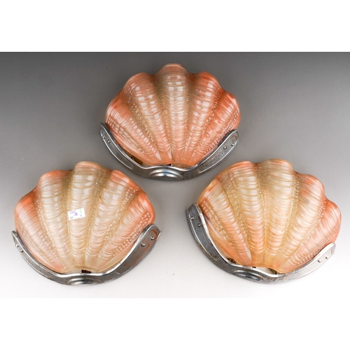 739 - A set of three Art Deco chrome mounted pink moulded glass scallop shaped wall lights (3 - untested)