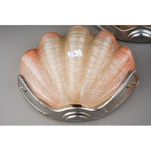 739 - A set of three Art Deco chrome mounted pink moulded glass scallop shaped wall lights (3 - untested)