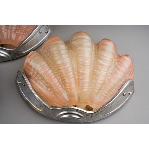 739 - A set of three Art Deco chrome mounted pink moulded glass scallop shaped wall lights (3 - untested)