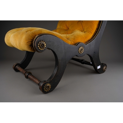 746 - A Regency style ebonised and gilt metal slipper chair, with button back gold velvet upholstery, the ... 