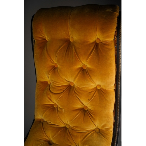 746 - A Regency style ebonised and gilt metal slipper chair, with button back gold velvet upholstery, the ... 