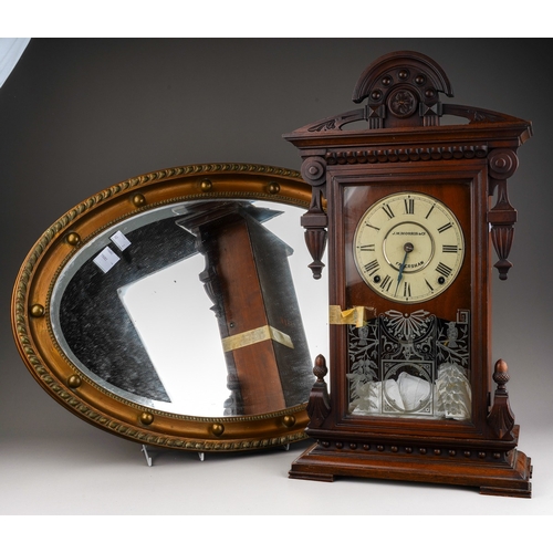 750 - A J W Morris & Co Faversham mahogany cased mantle clock together with a Georgian style gilt wood ova... 