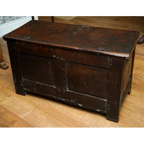 754 - West country Charles I oak coffer, single plank top, two foliate carved panels to the front, panelle... 