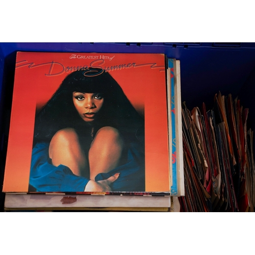 755 - A collection of approximately two hundred and twenty  seven LPs and  singles in a yellow record case... 