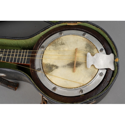 759 - A cased Swanee Banjo Ukulele, length 54.5cm, in well used condition