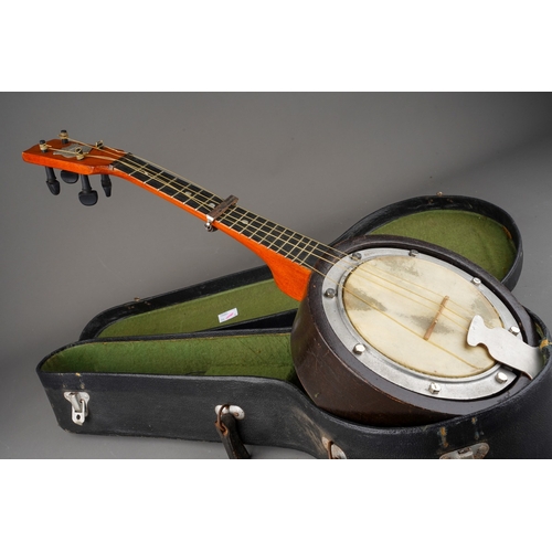 759 - A cased Swanee Banjo Ukulele, length 54.5cm, in well used condition