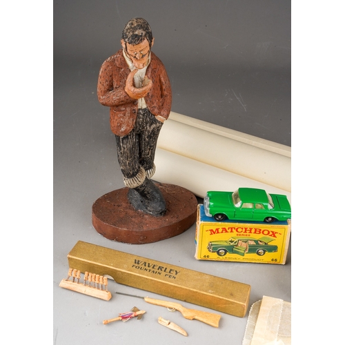 769 - A resin figure of a man, a Matchbox No. 46 Mercedes 300se coupe in green, a small tin of British and... 