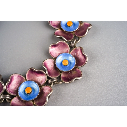 899 - Sterling silver and enamel flower link bracelet, gross weight 28g, marked sterling silver to all par... 