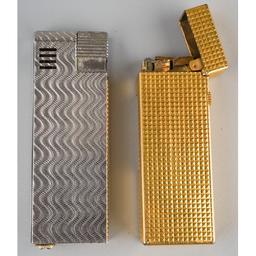 901 - Alfred Dunhill; A Dunhill gold plated rollagas pocket cigarette lighter, engine turned case together... 