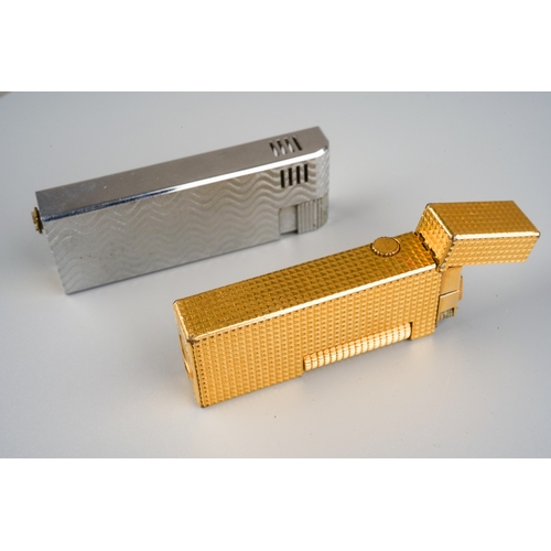 901 - Alfred Dunhill; A Dunhill gold plated rollagas pocket cigarette lighter, engine turned case together... 