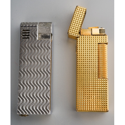 901 - Alfred Dunhill; A Dunhill gold plated rollagas pocket cigarette lighter, engine turned case together... 