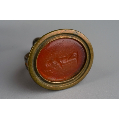 903 - Leather cased travelling ink well together with a red glass letter seat mounted in gilt metal