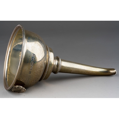 908 - An Elizabeth II silver wine funnel, two section, with gadrooned rims and shell shaped clip, sponsors... 