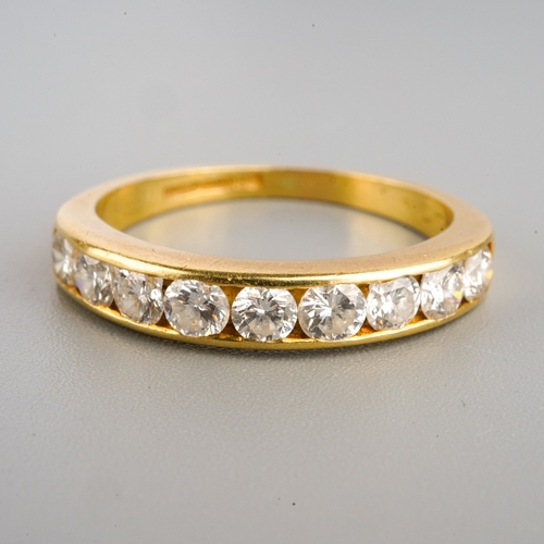 913 - An 18ct diamond half eternity ring, set with nine stones totalling 1.00 carat, hallmarked C.G & S, B... 