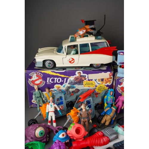 914 - A box and a bag of Kenner The Real Ghostbusters toys including 2 Ecto-1 Vehicles with boxes with cha... 