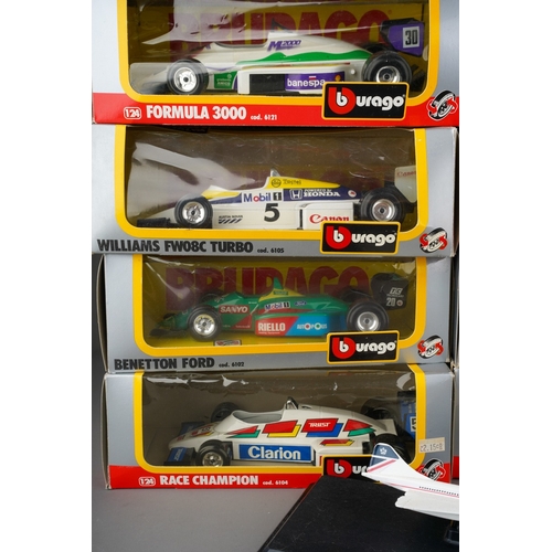 915 - A box of boxed and loose Burago and Corgi toy models comprising 10 boxed 1:24 scale Formula 1 cars a... 