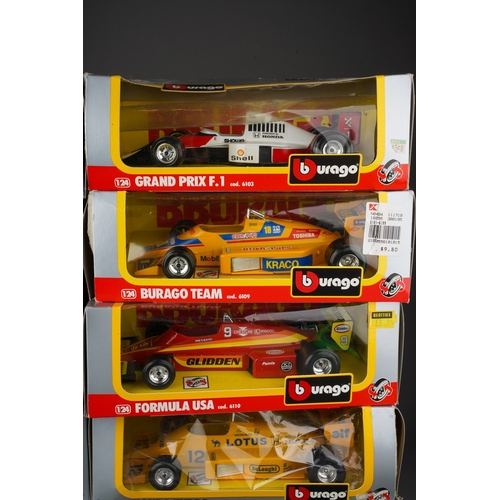 915 - A box of boxed and loose Burago and Corgi toy models comprising 10 boxed 1:24 scale Formula 1 cars a... 