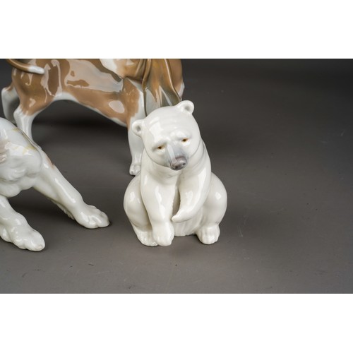 928 - 4 Porcelain animal figures comprising two Lladro dogs and a seated polar bear and a B&G Copenhagen p... 