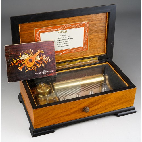 929 - A Rouge Music inlaid cylinder Music Box bears label to lid interior Thorens and 6 airs together with... 