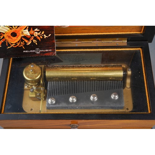 929 - A Rouge Music inlaid cylinder Music Box bears label to lid interior Thorens and 6 airs together with... 