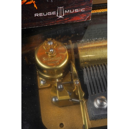 929 - A Rouge Music inlaid cylinder Music Box bears label to lid interior Thorens and 6 airs together with... 