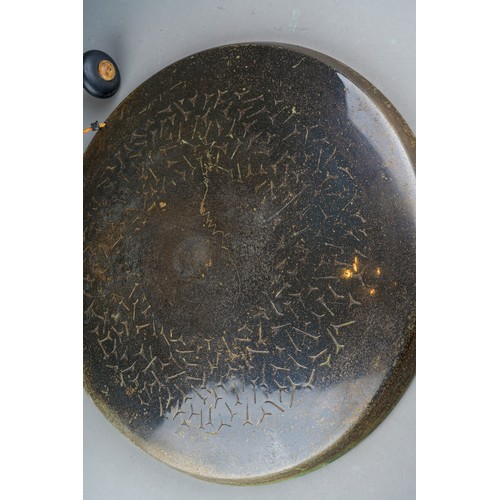 931 - A late 19th/early 20th Century base metal wall-hanging dinner gong.  Suspended from an embossed eagl... 