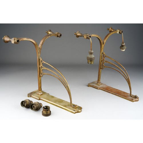 934 - A pair of early 20th Century twin branch brass bracket light fittings