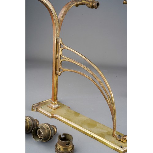 934 - A pair of early 20th Century twin branch brass bracket light fittings