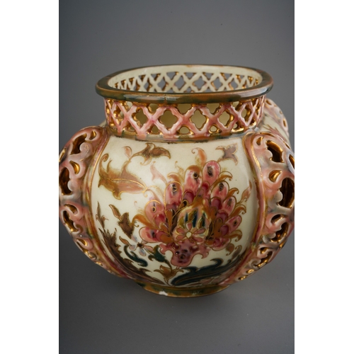 4 - An early 20th century Zsolnay Pecs oval jardiniere, decorated with Isnik style flowers with gilt det... 