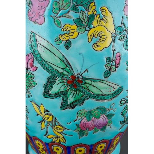 19 - A second half 20th Chinese porcelain baluster vase, turquoise ground polychrome enamelled with flora... 