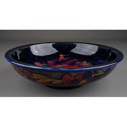 54 - A Moorcroft Pottery Bowl, decorated in 'Pomegranite' pattern, 24cm diameter