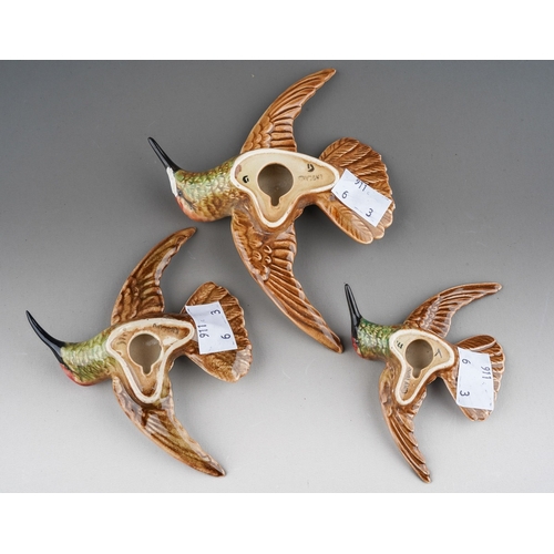 63 - A set of three graduated Beswick Hummingbird wall plaques, model nos 1023-1, 1023-2 & 1023-3, wingsp... 