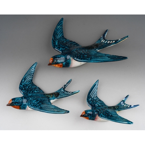 64 - A graduated set of three Beswick Swallow wall plaques, model nos 757-1, 757-2 and 757-3, printed and... 