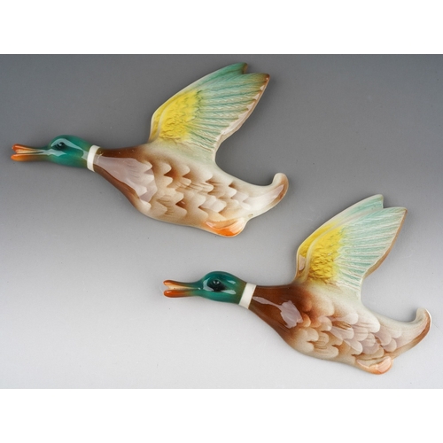 65 - Two graduated Keele Street Pottery flying duck wall plaques, large and medium size, length of larges... 