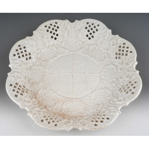 73 - An 18th Century salt glazed plate, press moulded of lobed octagonal form, with lattice work decorati... 