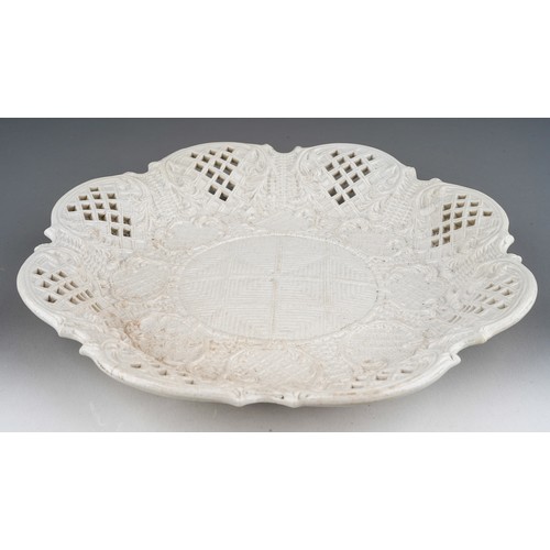 73 - An 18th Century salt glazed plate, press moulded of lobed octagonal form, with lattice work decorati... 