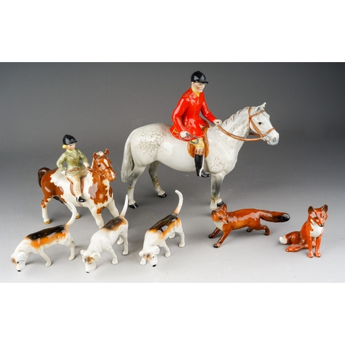 115 - A collection of Beswick Hunting figures comprising Huntsman on grey horse af, girl on pony, two foxe... 