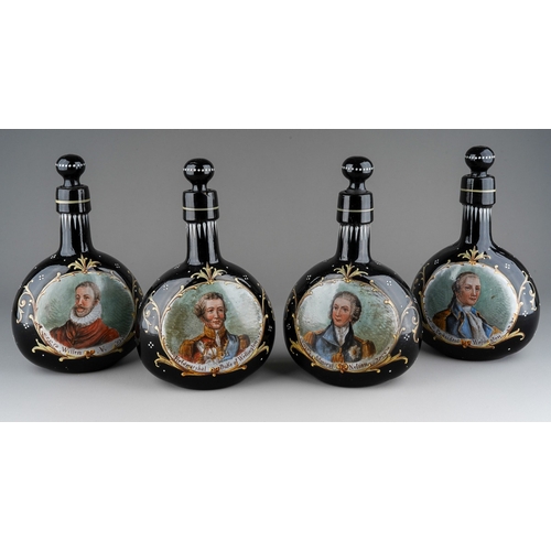 122 - A set of four 19th century dark coloured glass decanters of flattened ovoid form, all with stoppers,...