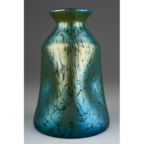 125 - A Loetz style iridescent vase, the flared rim over pinched in body, unmarked, height 11.5cm