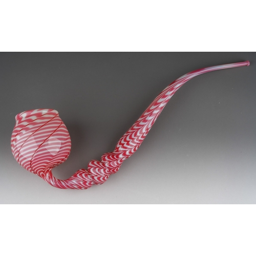 127 - A Nailsea pink and white opaque glass pipe, 54cm long