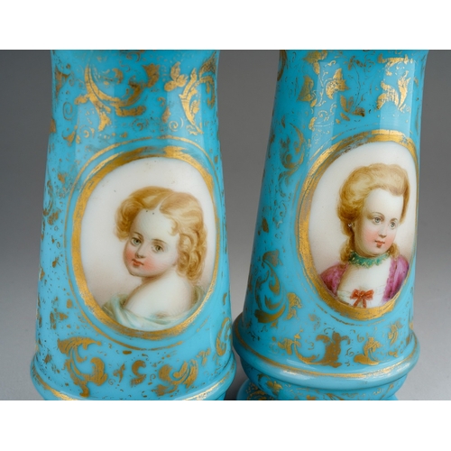 129 - A pair of Victorian cased glass vases of footed baluster form, the turquoise and gilt ground painted... 