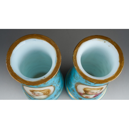 129 - A pair of Victorian cased glass vases of footed baluster form, the turquoise and gilt ground painted... 