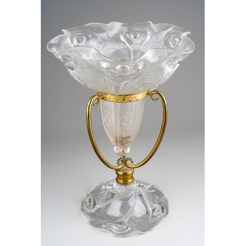 130 - A late 19th century clear glass single vase epergne in a gilt metal frame, probably John Walsh Walsh... 