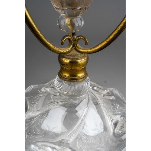 130 - A late 19th century clear glass single vase epergne in a gilt metal frame, probably John Walsh Walsh... 